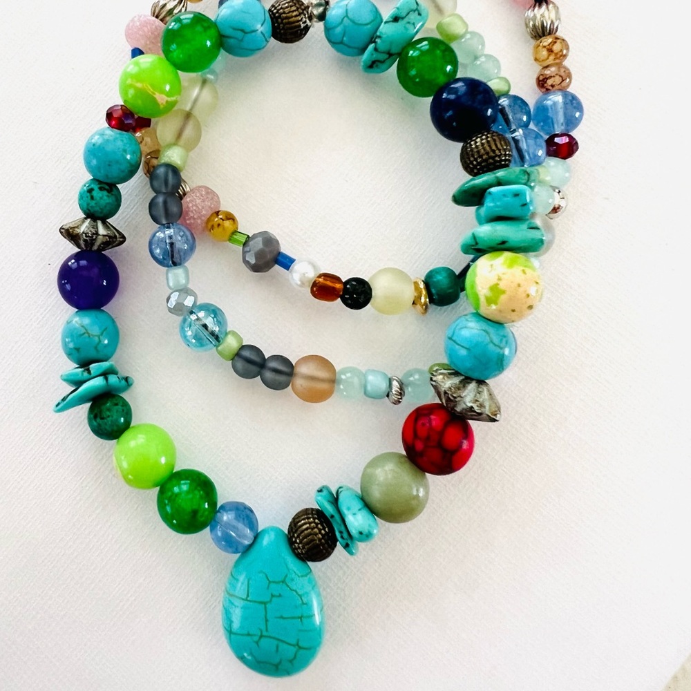 Multi colored stack of 3  beaded stretch bracelets